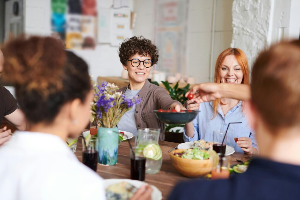 Group of friends enjoying a healthy meal together while living a sober lifestyle.