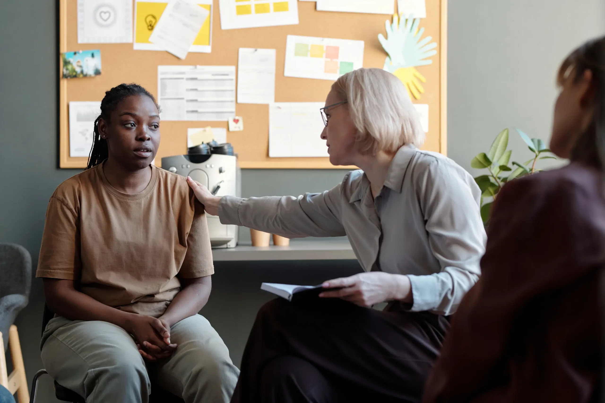 Therapist comforting a patient during a group therapy session at My Time Recovery.